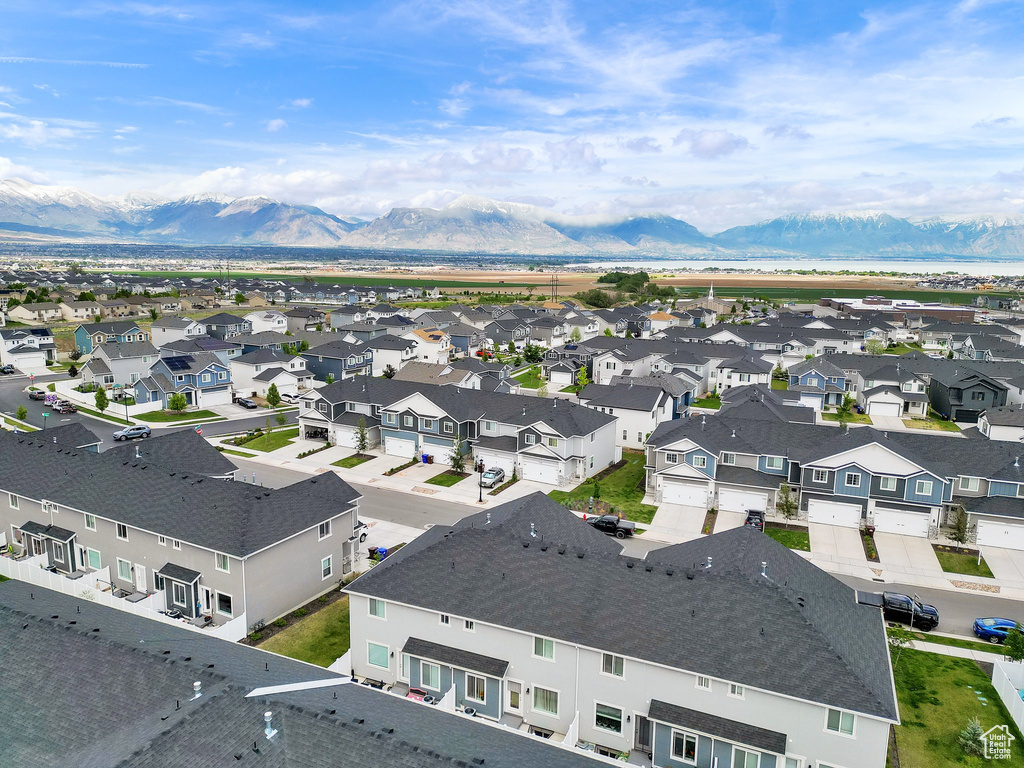 Aerial perspective of suburban area with a mountain backdrop