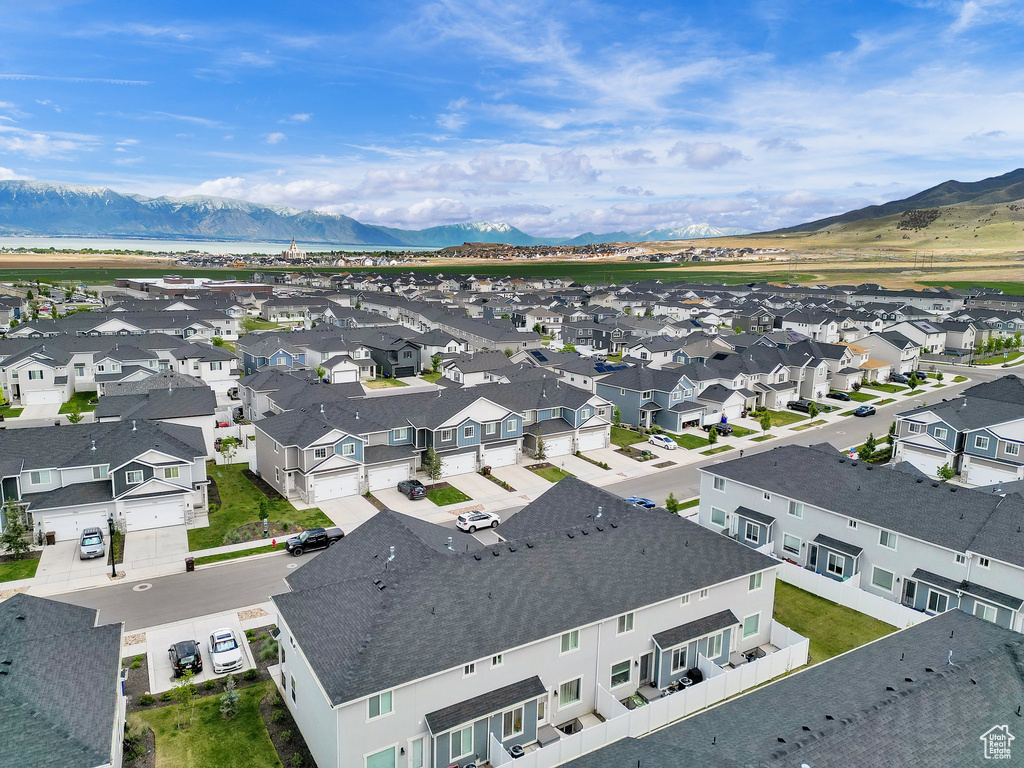 Aerial view of residential area featuring a mountainous background