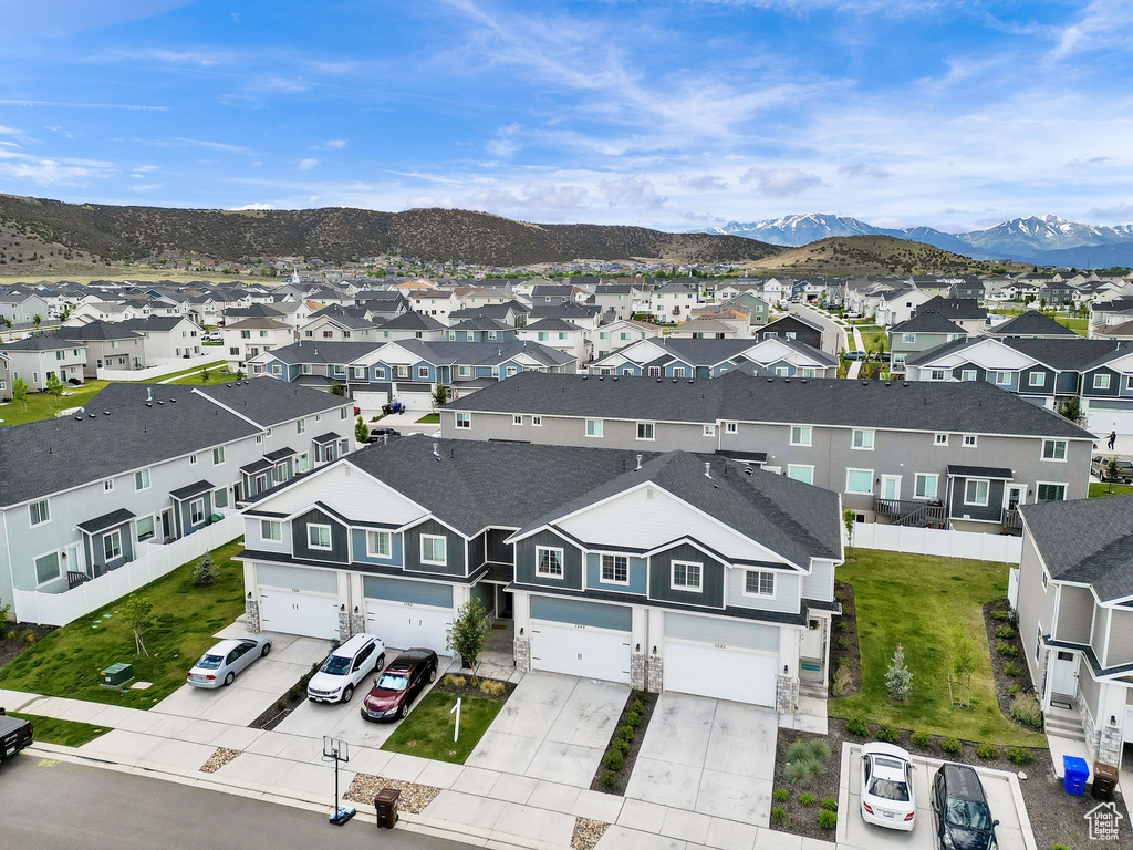 Aerial view of residential area featuring mountains