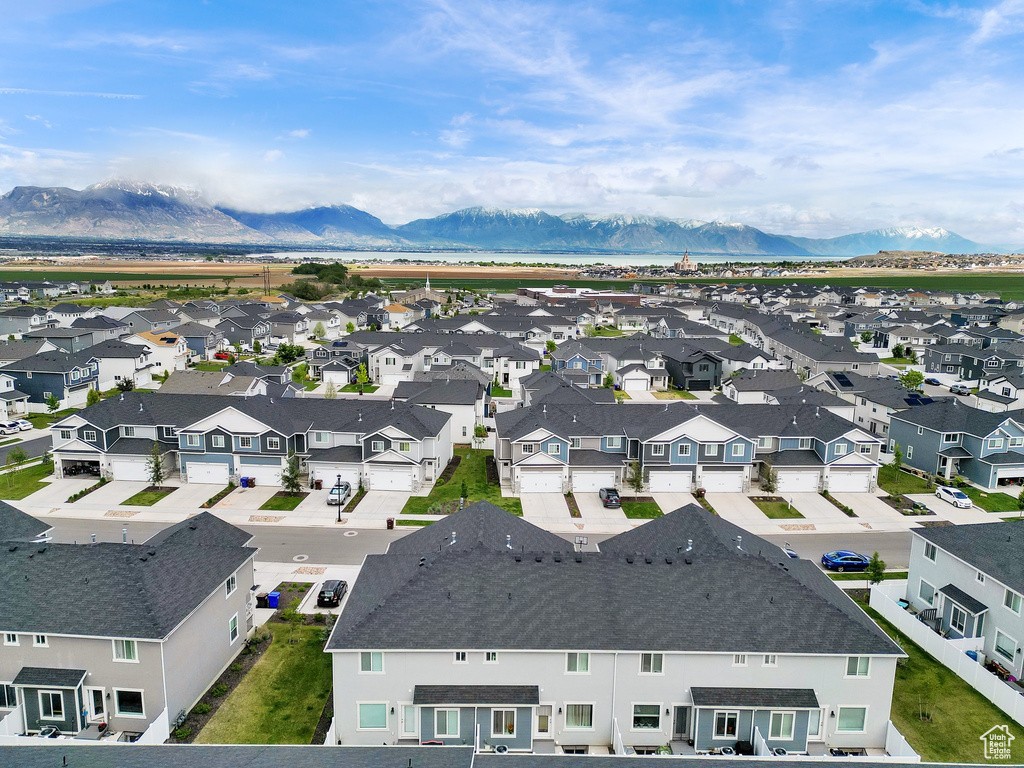 Aerial perspective of suburban area featuring a mountain backdrop