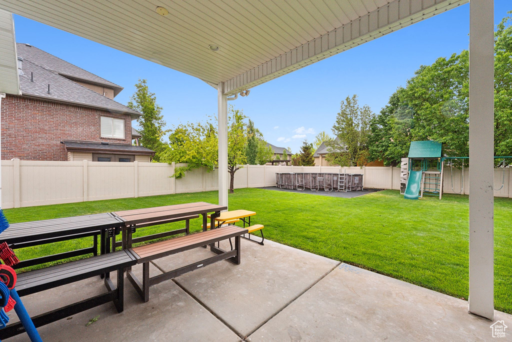 View of patio / terrace featuring outdoor dining space and a playground