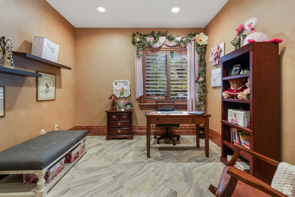 Office with marble look tiles and recessed lighting