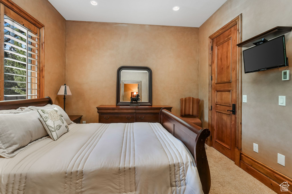 Bedroom with carpet floors and recessed lighting