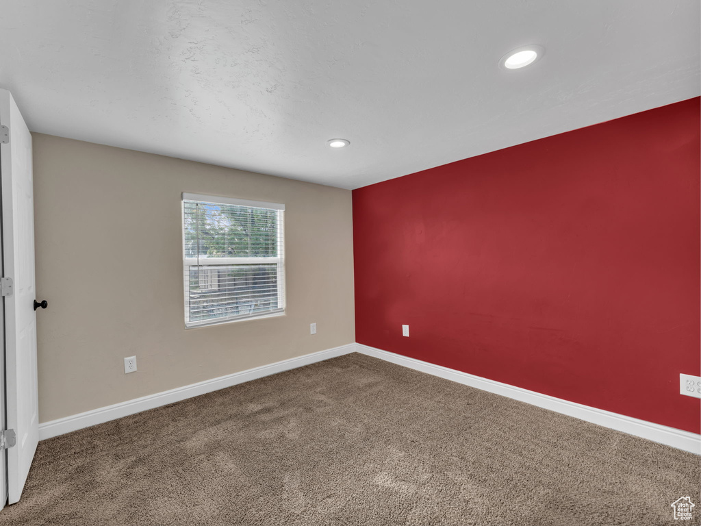 Unfurnished room with carpet, recessed lighting, and baseboards