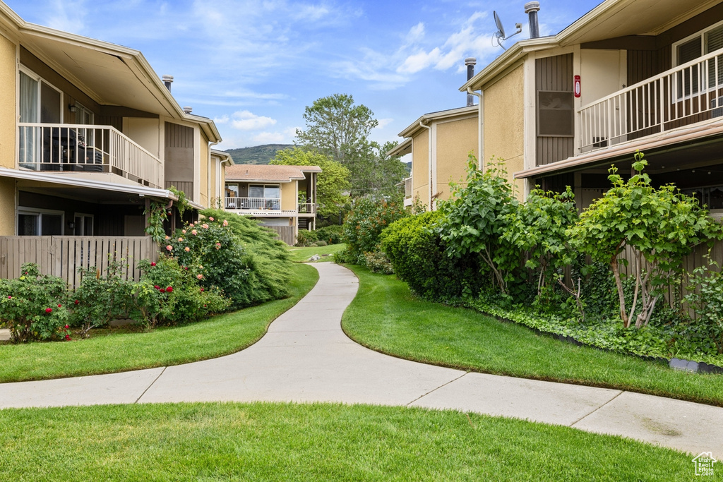 View of home\'s community featuring a lawn
