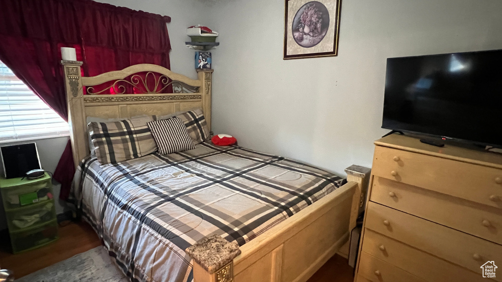 Bedroom with wood finished floors