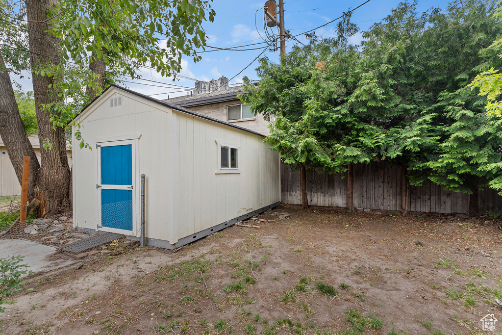 View of shed featuring a fenced backyard