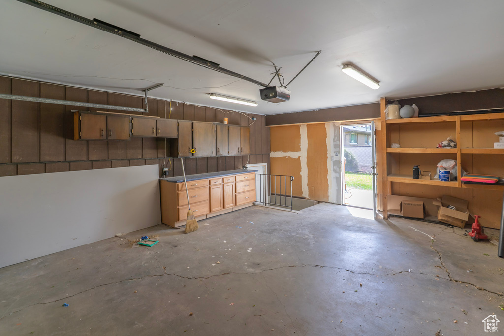 Garage featuring a garage door opener
