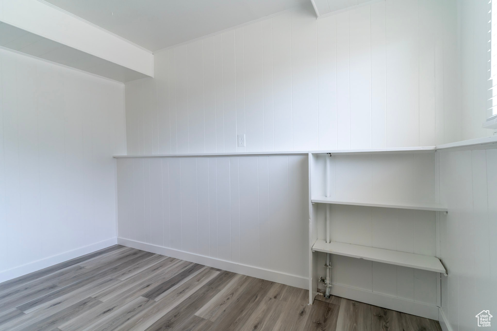 Spacious closet with wood finished floors