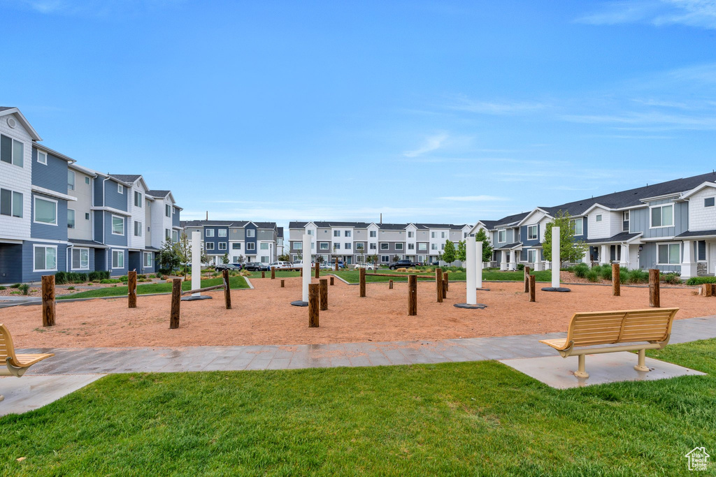 View of play area featuring a residential view and a lawn