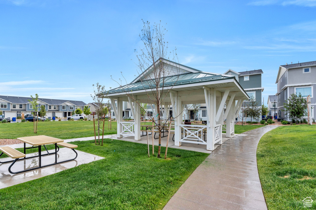 View of home\'s community with a residential view, a lawn, and a gazebo