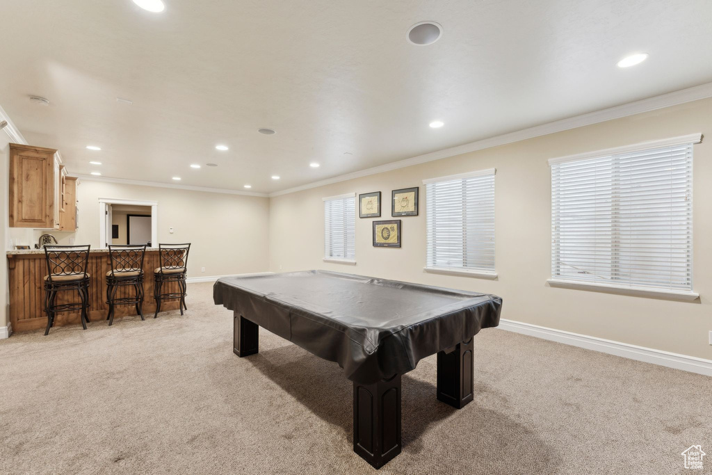 Playroom with light colored carpet, baseboards, recessed lighting, billiards table, and crown molding