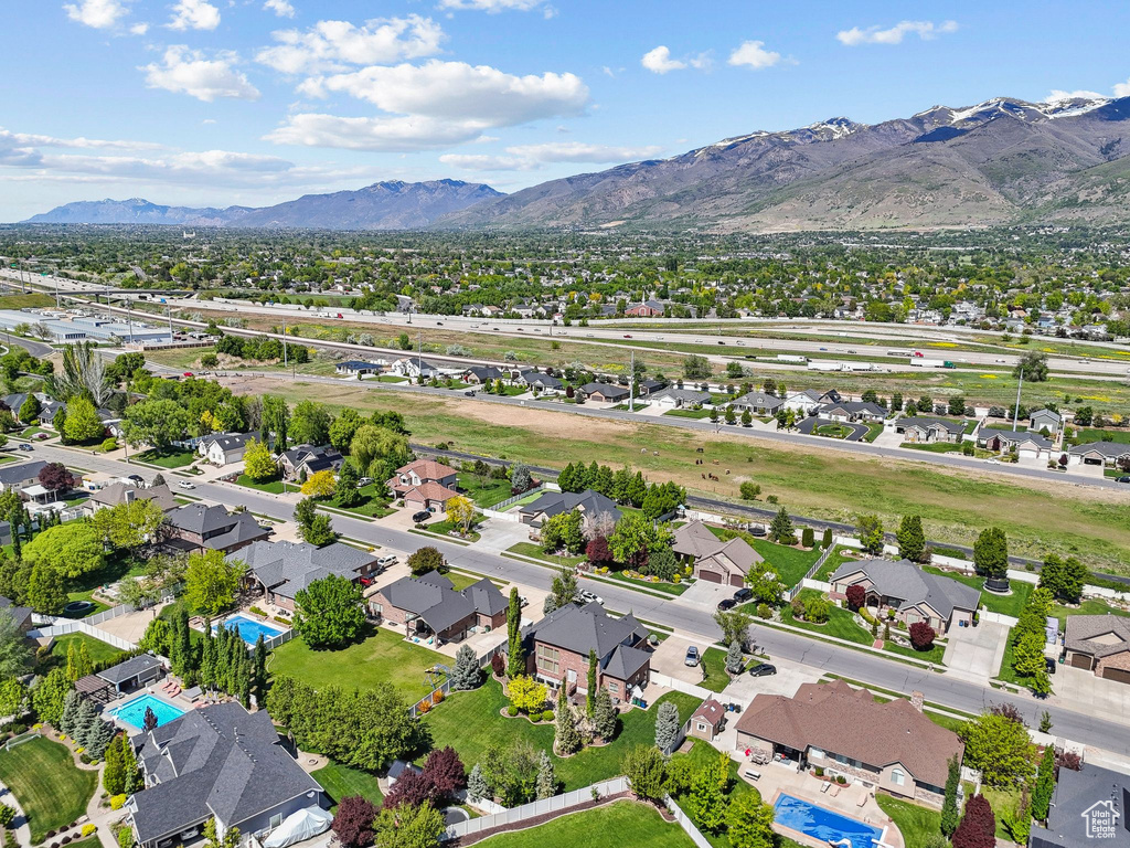 Aerial view of residential area featuring a mountainous background