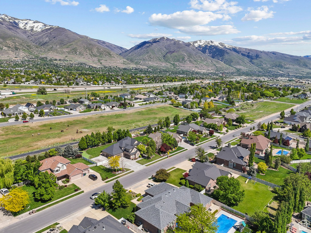 Aerial view of residential area featuring a mountain backdrop