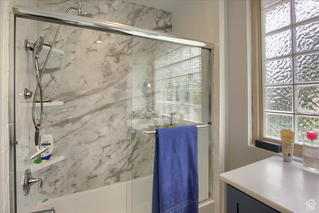Full bathroom featuring enclosed tub / shower combo