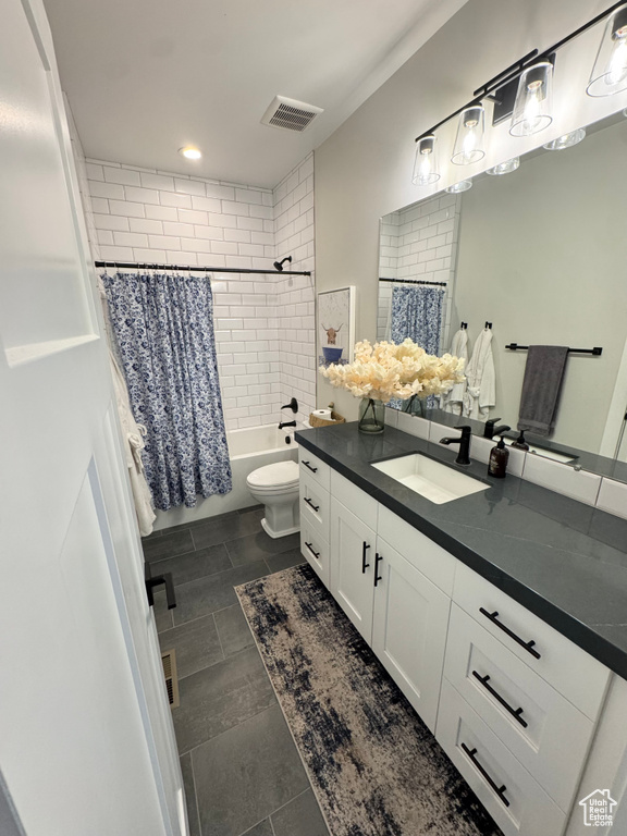 Full bath with toilet, vanity, shower / bath combo, recessed lighting, and tile patterned floors