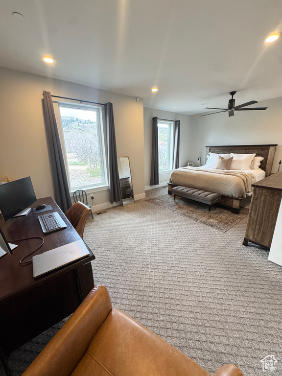 Carpeted bedroom with an office area, recessed lighting, baseboards, and ceiling fan