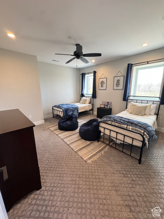 Carpeted bedroom with baseboards, recessed lighting, and a ceiling fan