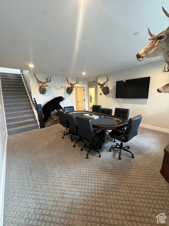 Office space with carpet flooring and baseboards