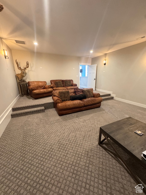 Living area featuring carpet floors and baseboards