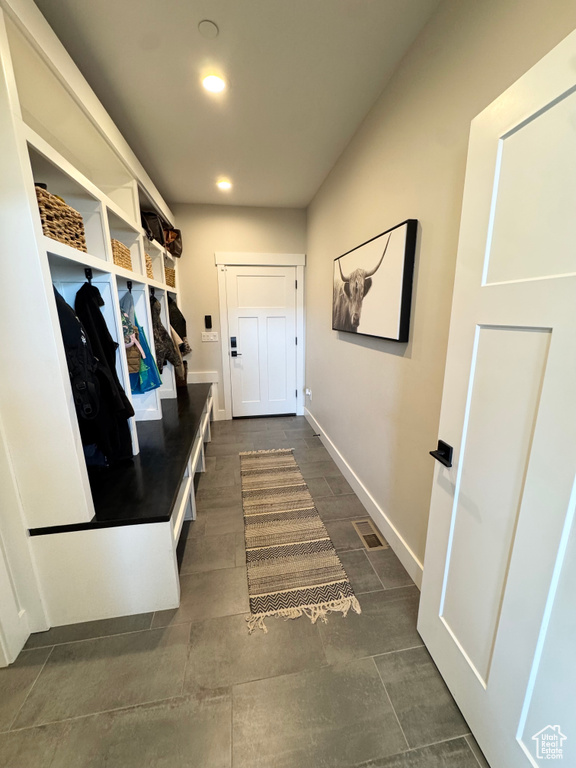 Mudroom featuring baseboards and recessed lighting
