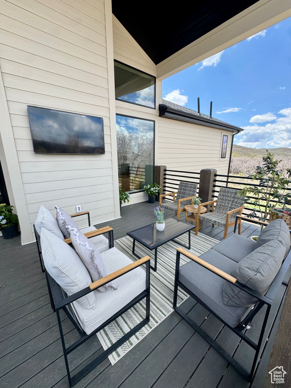 Deck with an outdoor living space
