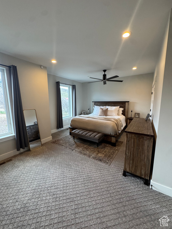 Carpeted bedroom with baseboards, recessed lighting, and a ceiling fan