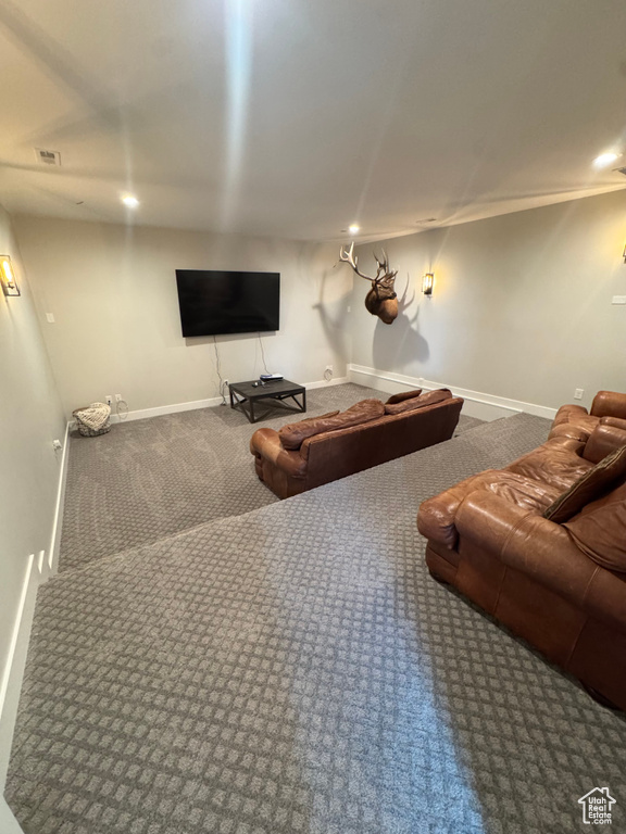 Carpeted cinema room featuring recessed lighting and baseboards