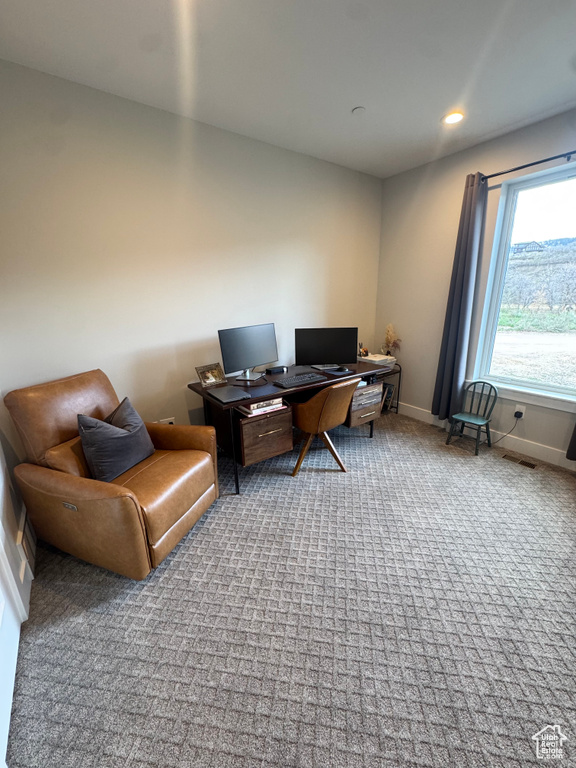 Carpeted office with baseboards and recessed lighting