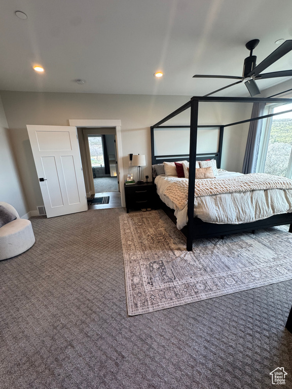 Bedroom with multiple windows, carpet floors, and recessed lighting