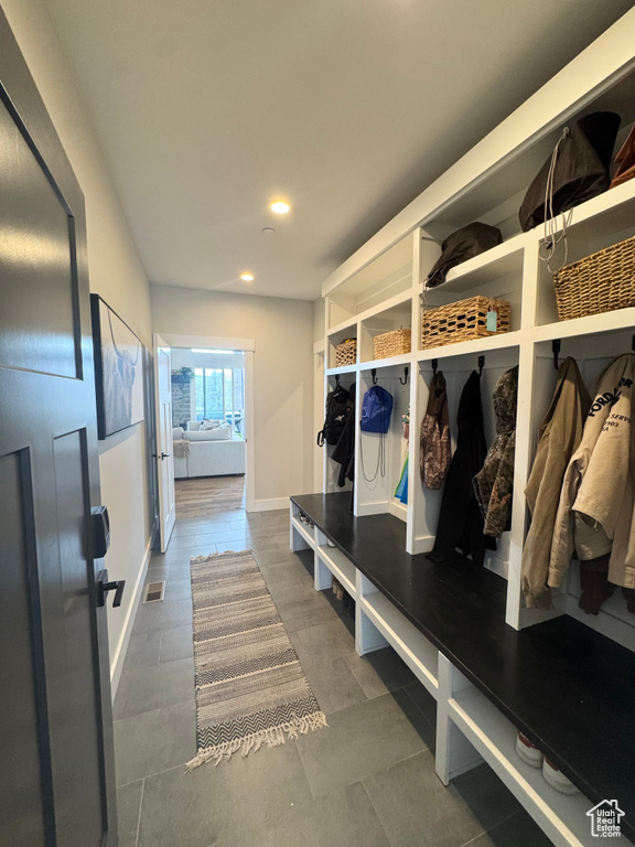 Mudroom featuring recessed lighting and baseboards