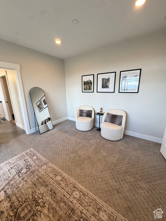 Sitting room featuring carpet, recessed lighting, and baseboards