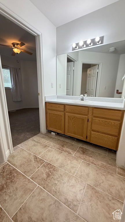 Bathroom featuring vanity and ceiling fan