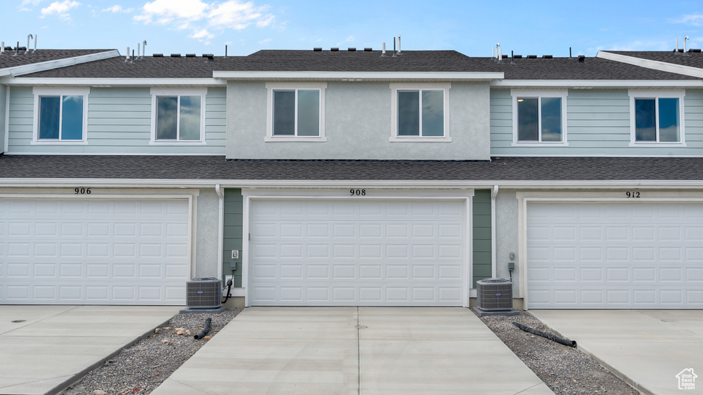 Garage with cooling unit and driveway