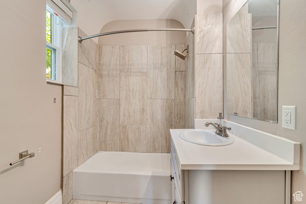 Full bath featuring vanity and tub / shower combination
