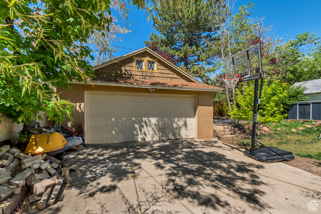 Garage with concrete driveway