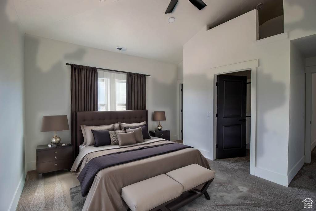 Bedroom featuring carpet flooring, baseboards, vaulted ceiling, and a ceiling fan