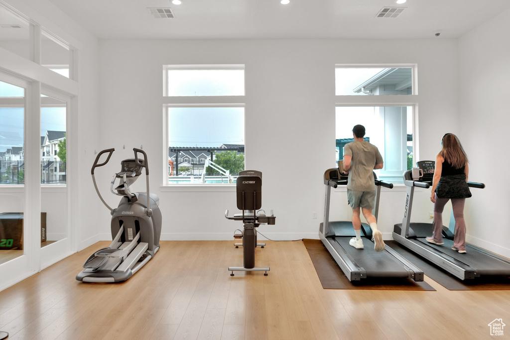 Exercise area featuring recessed lighting and wood finished floors