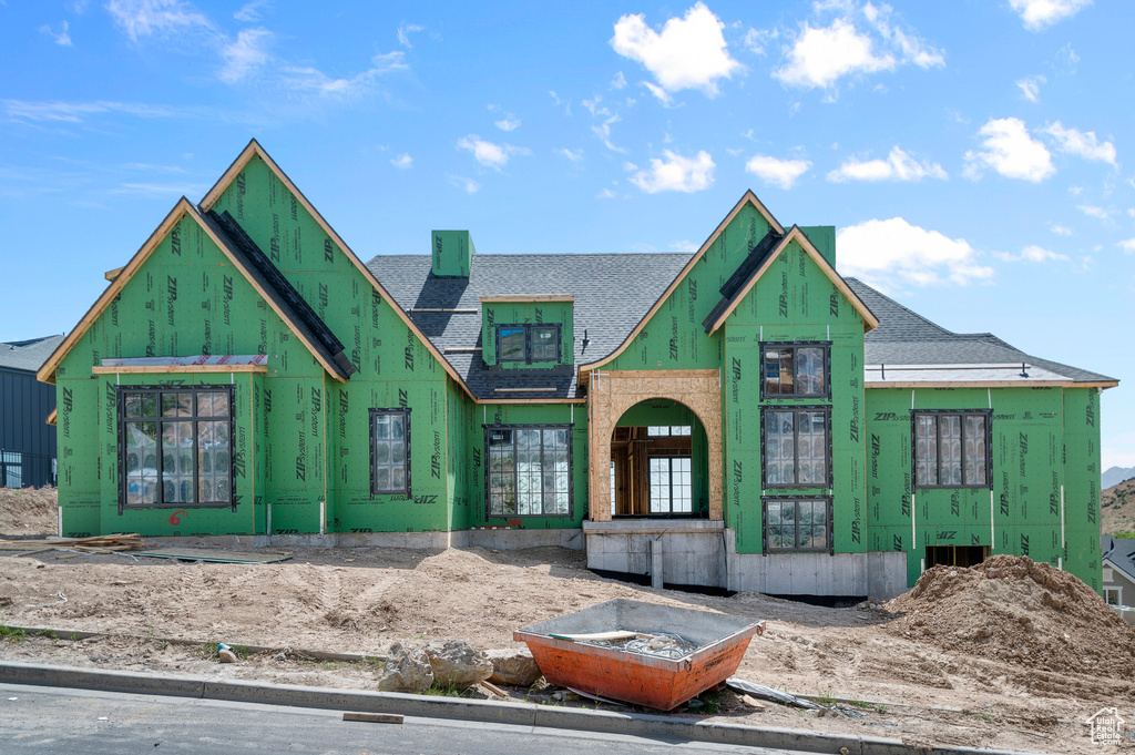 Unfinished property with roof with shingles