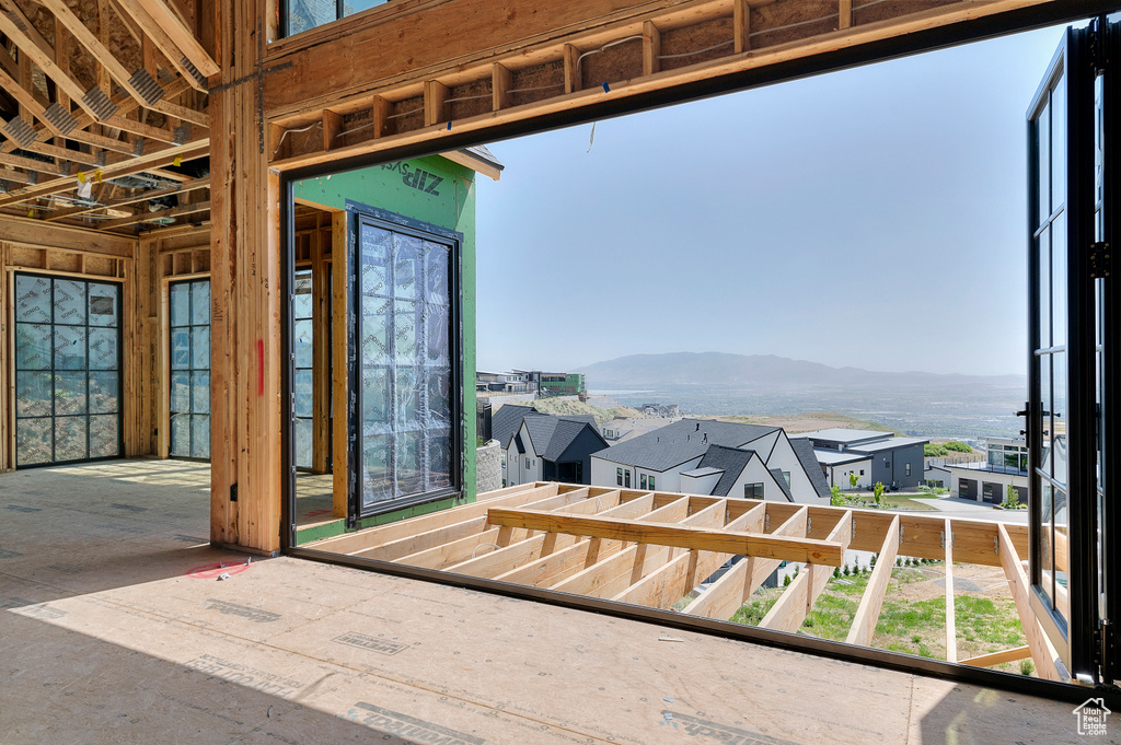 Sunroom / solarium with a mountain view