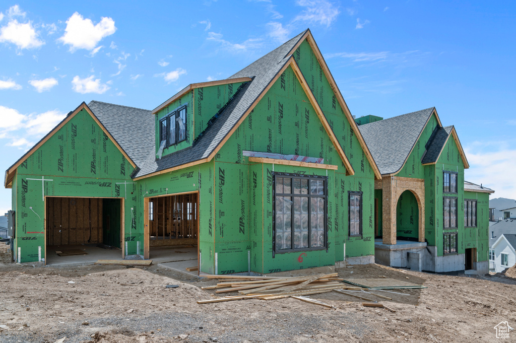 Property under construction featuring roof with shingles