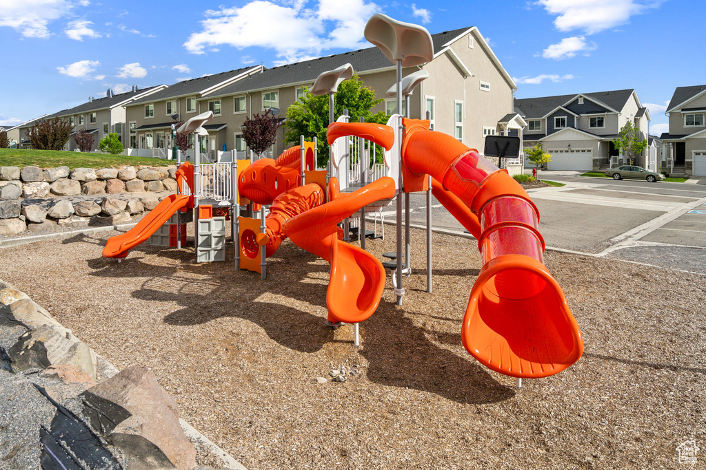 Community jungle gym with a residential view
