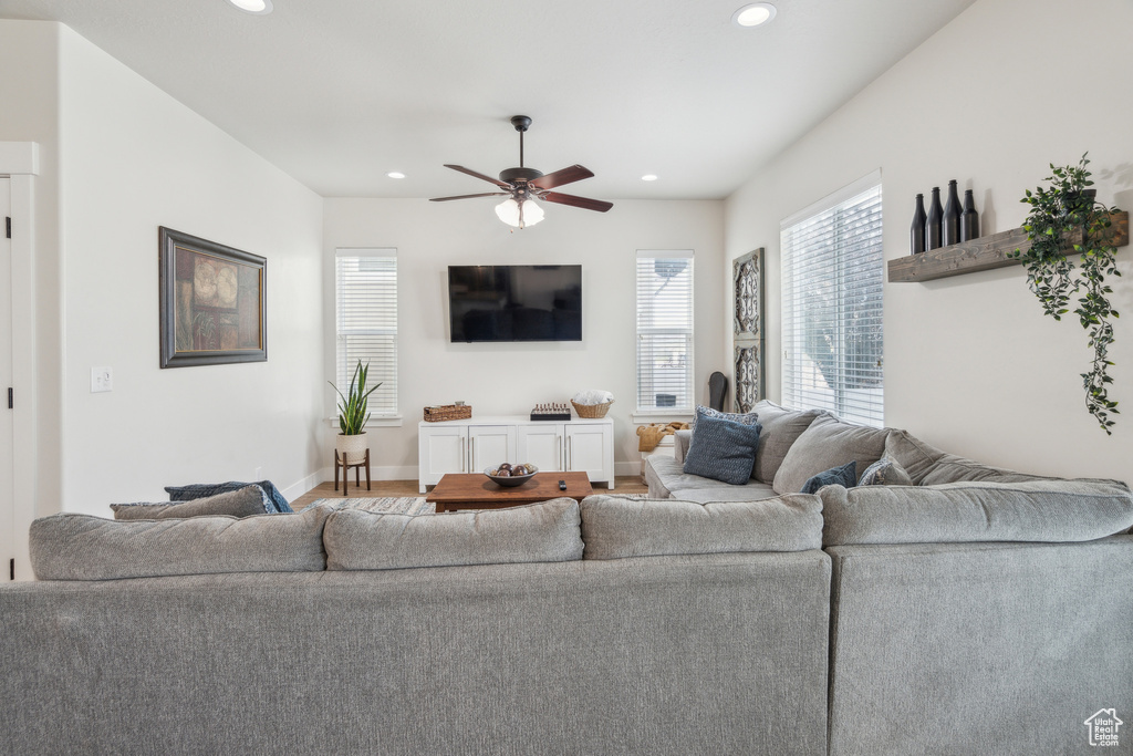 Living area featuring ceiling fan, recessed lighting, and baseboards