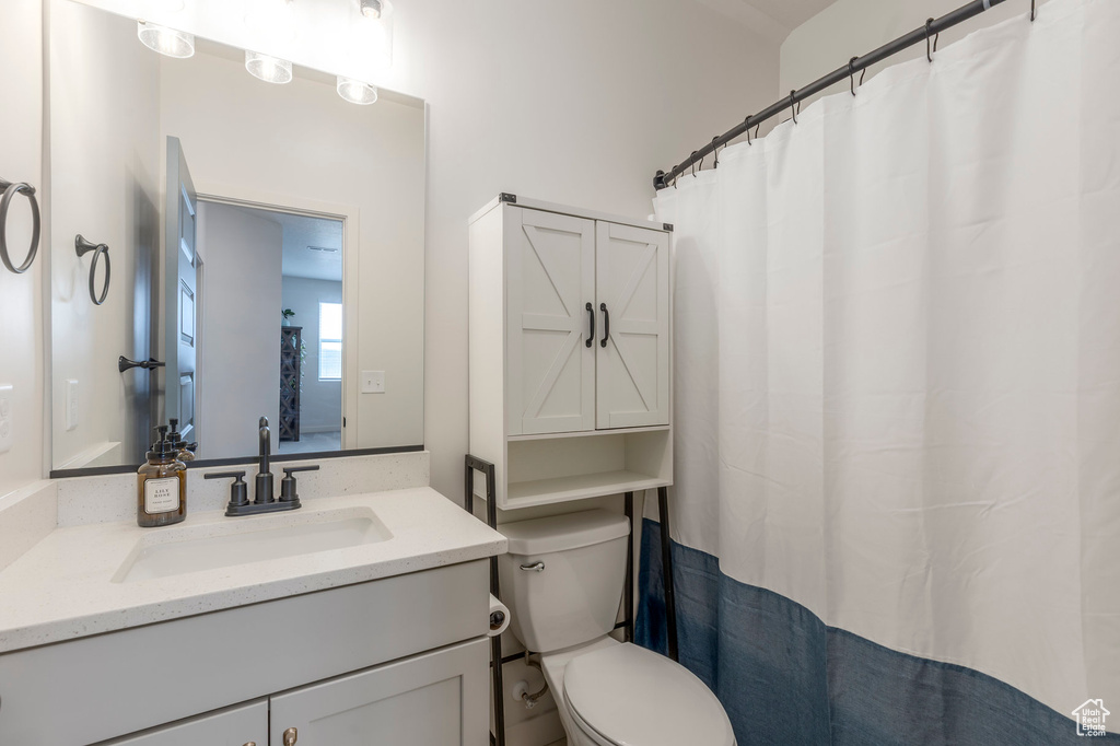 Bathroom with toilet and vanity