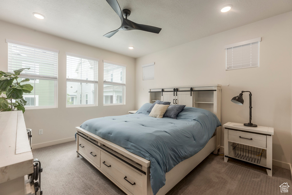 Carpeted bedroom with baseboards, recessed lighting, and ceiling fan