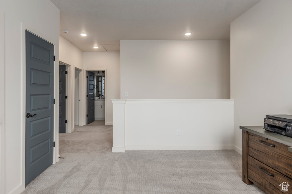 Interior space with light carpet, recessed lighting, and baseboards