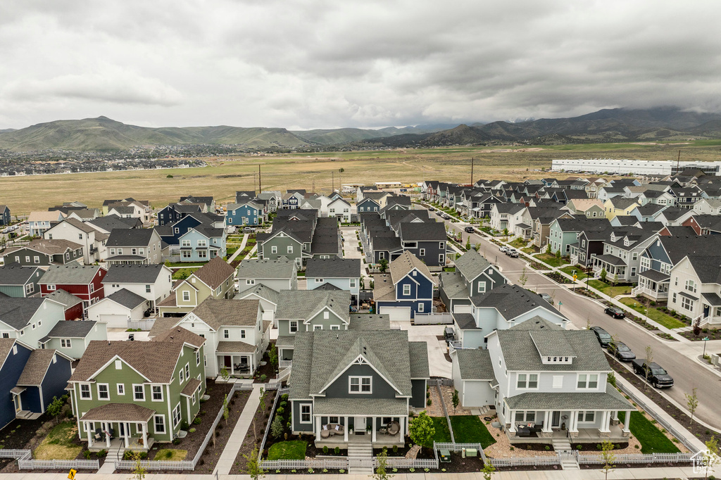 Aerial perspective of suburban area featuring a mountainous background