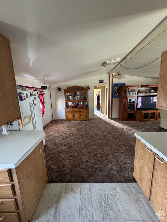 Living area with light carpet and light marble finish flooring