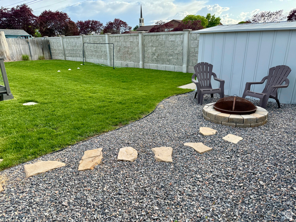 View of yard featuring a fire pit