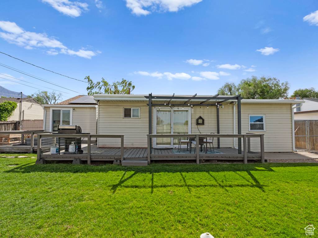 Rear view of property with a wooden deck
